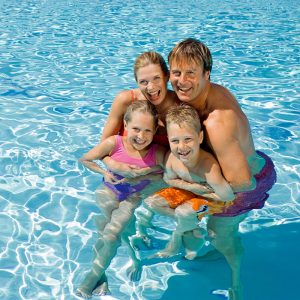 Family in swimming pool